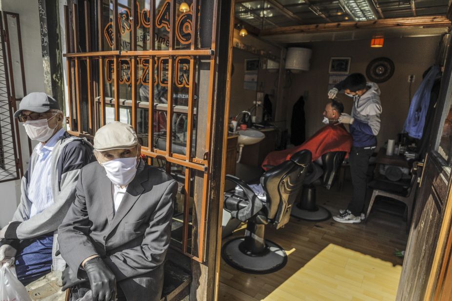 A man gets his hair cut in Sarajevo, Bosnia and Herzegovina, on May 4. Some retail shops and hairdressers started to reopen as the Balkan states gradually lifted coronavirus measures.