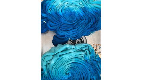 Olivia Horan swirling her tie-dye before putting on rubber bands