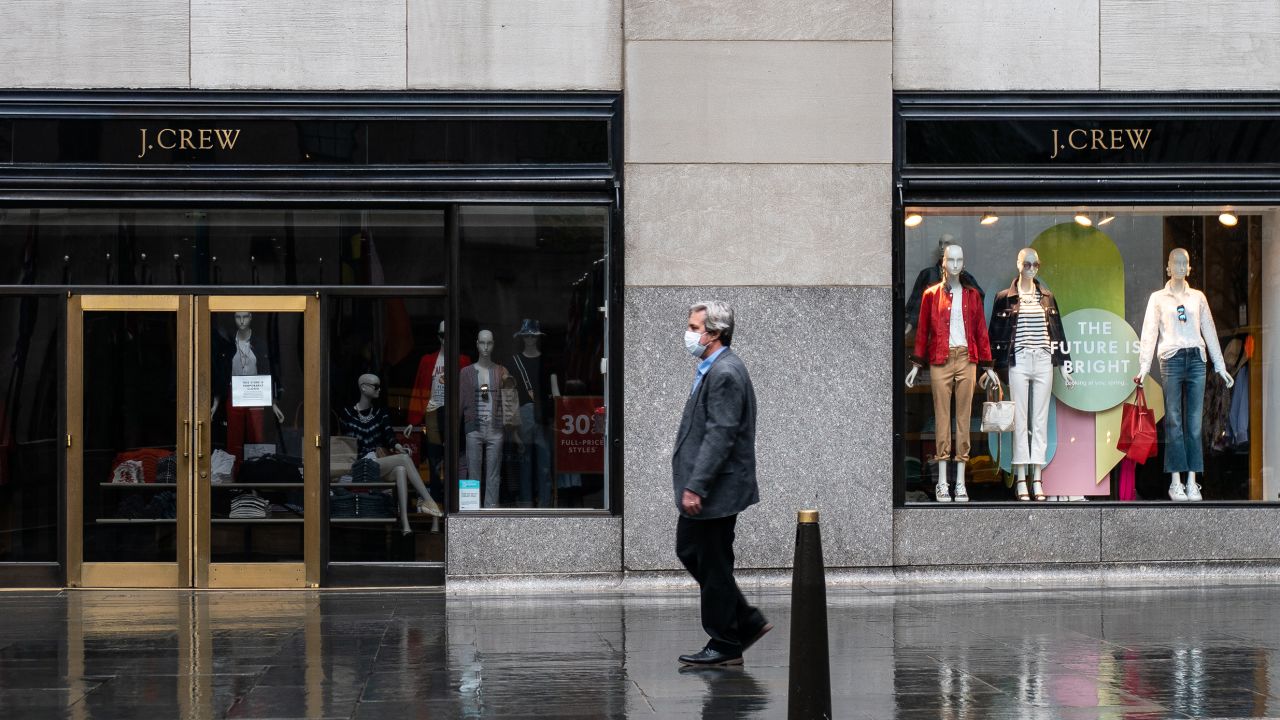 A person walks past a J. Crew Store on Madison Avenue on May 1, 2020 in New York City. Clothing apparel company J. Crew is preparing for a file for bankruptcy protection.