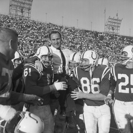 Shula is carried by members of the Baltimore Colts after they clinched a division title in 1964. Shula became the Colts' head coach in 1963. He was 33 at the time, which made him the league's youngest head coach in history. The Colts were very successful under Shula, and they were heavy favorites to win Super Bowl III before they were upset by the New York Jets in 1969.