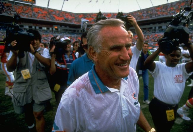 Shula is surrounded by cameras after a win against Kansas City in 1993. He had just tied George Halas for most wins by an NFL head coach.