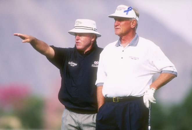Shula plays with Jim Colbert at a charity golf tournament in 1996.