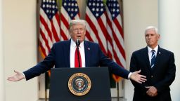 President Donald Trump speaks about the coronavirus in the Rose Garden of the White House, Monday, April 27, 2020, in Washington, as Vice President Mike Pence listens. 