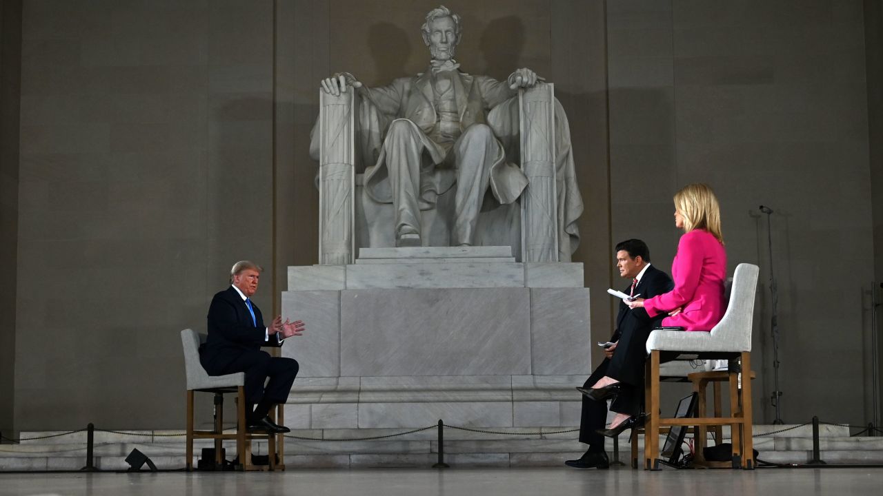 US President Donald Trump speaks during a Fox News virtual town hall "America Together: Returning to Work," event, with anchors Bret Baier (C) and Martha MacCallum (R), from the Lincoln Memorial in Washington, DC on May 3, 2020. - Trump will answer questions submitted by viewers on Twitter, Facebook and Instagram. (Photo by JIM WATSON / AFP) (Photo by JIM WATSON/AFP via Getty Images)