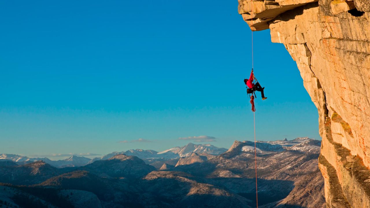 Chin ascending a fixed line to the top of the Visor on Half Dome in Yosemite, US. 