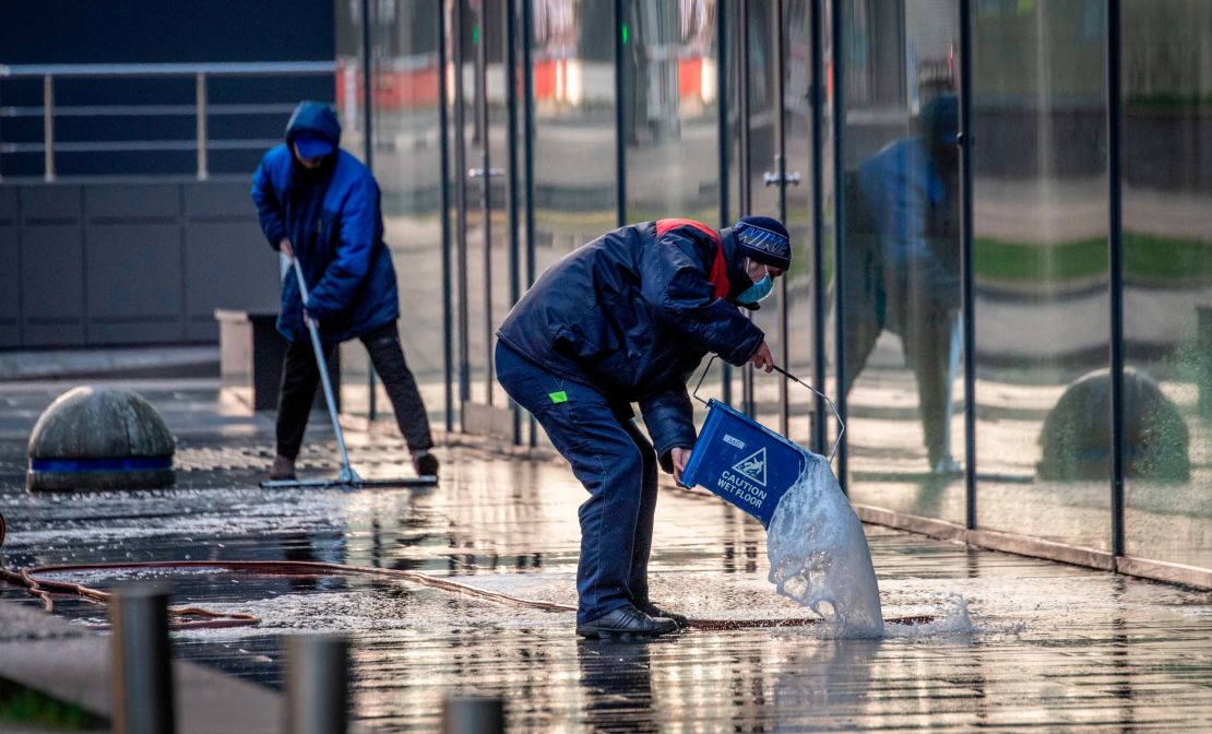 Workers clean a street in central Moscow on May 2.