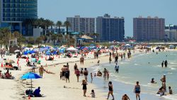 CLEARWATER, FL - MAY 04: People visit Clearwater Beach after Governor Ron DeSantis opened the beaches at 7am on May 04, 2020 in Clearwater, Florida.  Restaurants, retailers, beaches and some state parks reopen today with caveats, as the state continues to ease restrictions put in place to contain COVID-19.  (Photo by Mike Ehrmann/Getty Images)