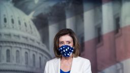 US Speaker of the House Nancy Pelosi wears a mask to protect herself and others from COVID-19, known as coronavirus, as she arrives to hold her weekly press conference on Capitol Hill in Washington, DC, April 30, 2020. - The US Federal Reserve said April 30, 2020 it is expanding its business loan program to reach more firms as companies struggle to weather the impact of the coronavirus shutdowns. (Photo by SAUL LOEB / AFP) (Photo by SAUL LOEB/AFP via Getty Images)