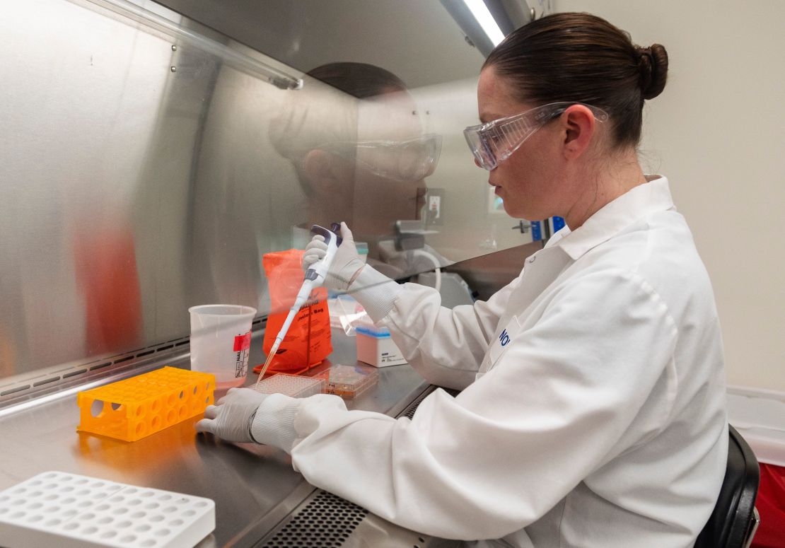 Dr. Rhonda Flores looks at protein samples at Novavax labs in Rockville, Maryland.