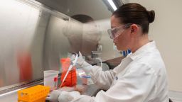 Dr. Rhonda Flores looks at protein samples at Novavax labs in Rockville, Maryland on March 20, one of the labs developing a vaccine for the coronavirus.