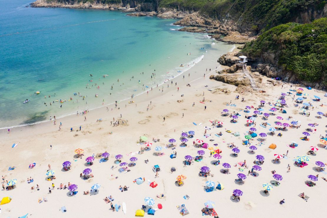 People at a beach in Hong Kong on April 19.