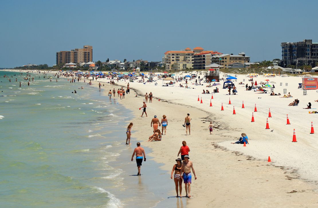 People visit Clearwater Beach after Governor Ron DeSantis opened the beaches at 7am on May 4 Clearwater, Florida.