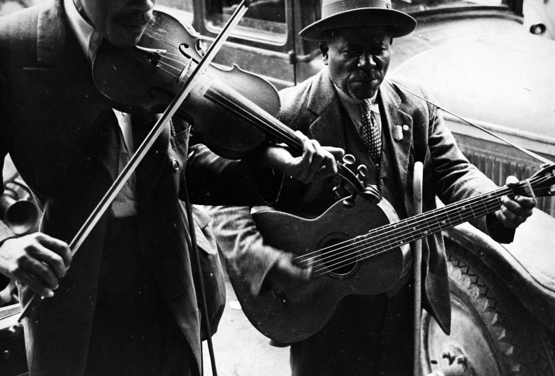 Two street musicians try to earn a living in West Memphis, Arkansas, in 1935. 