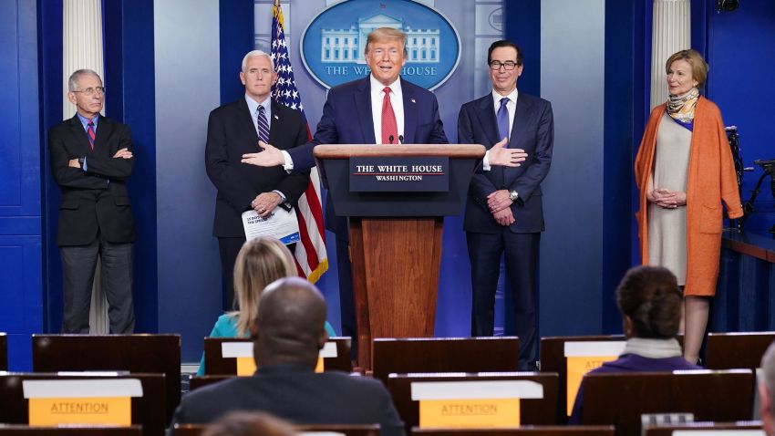 US President Donald Trump, flanked by (from R) Response coordinator for White House Coronavirus Task Force Deborah Birx, US Treasury Secretary Steven Mnuchin, US Vice President Mike Pence and Director of the National Institute of Allergy and Infectious Diseases Anthony Fauci, speaks during the daily briefing on the novel coronavirus, COVID-19, in the Brady Briefing Room at the White House on March 25, 2020, in Washington, DC.