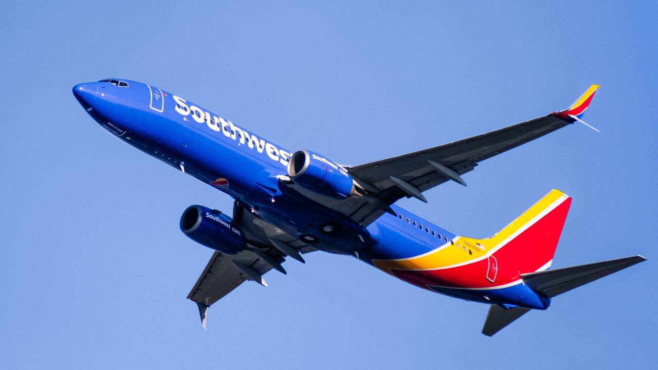 underscored southwest airlines plane in blue sky