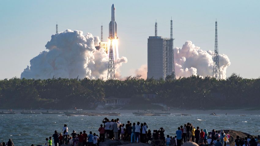 In this photo released by Xinhua News Agency, China's new large carrier rocket Long March-5B blasts off from the Wenchang Space Launch Center in southern China's Hainan Province, May 5, 2020. The Long March-5B made its maiden flight on Tuesday, sending the trial version of China's new-generation manned spaceship and a cargo return capsule for test into space. (Guo Cheng/Xinhua via AP)