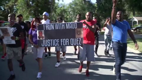 Protesters chant, "I run with Maud" Tuesday in the Satilla Shores, where Arbery was killed. 