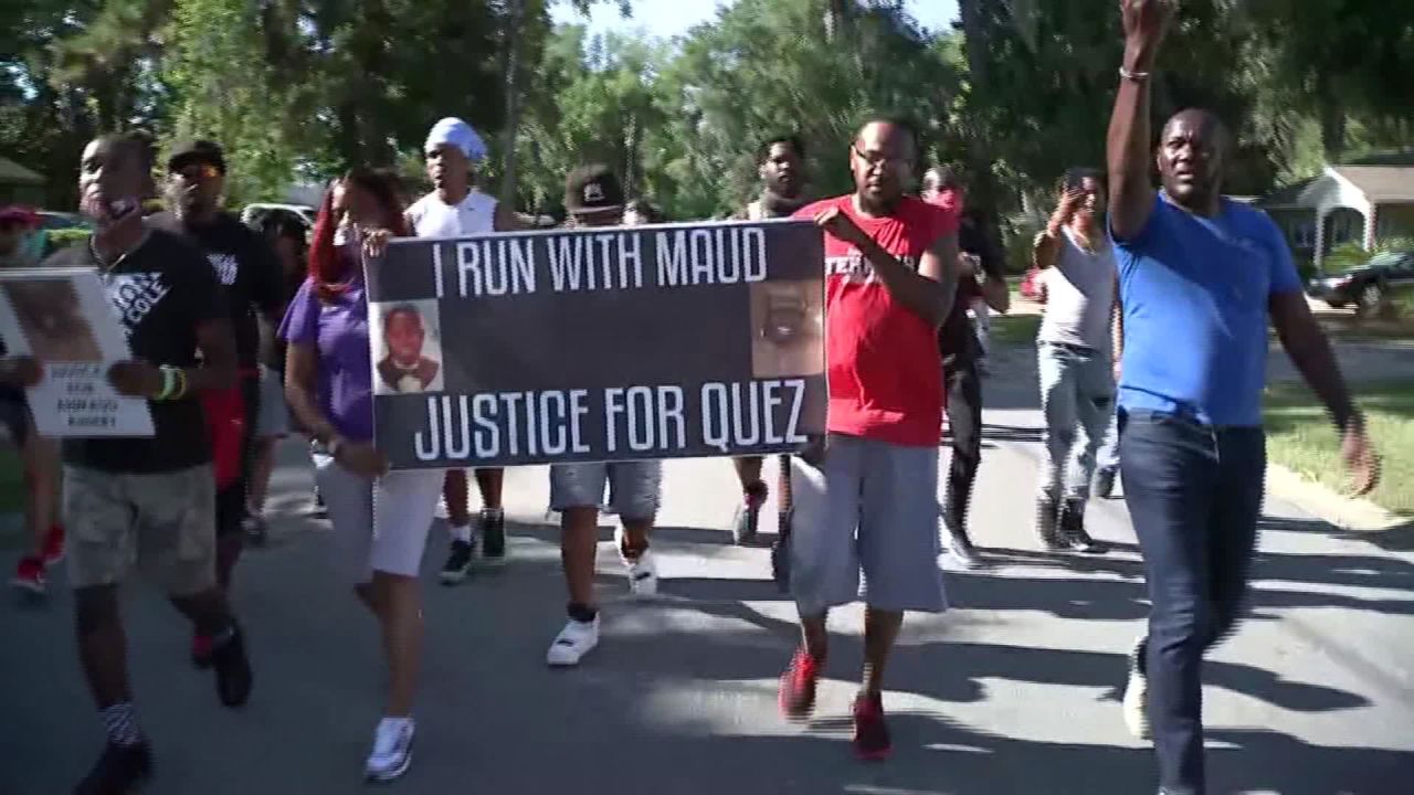 Protesters chant, "I run with Maud" Tuesday in the Satilla Shores, where Arbery was killed. 