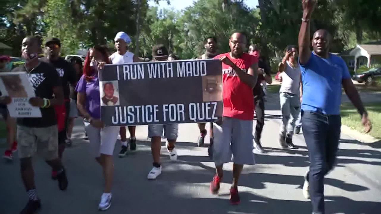 Protesters chant, "I run with Maud" Tuesday in the Satilla Shores, where Arbery was killed.