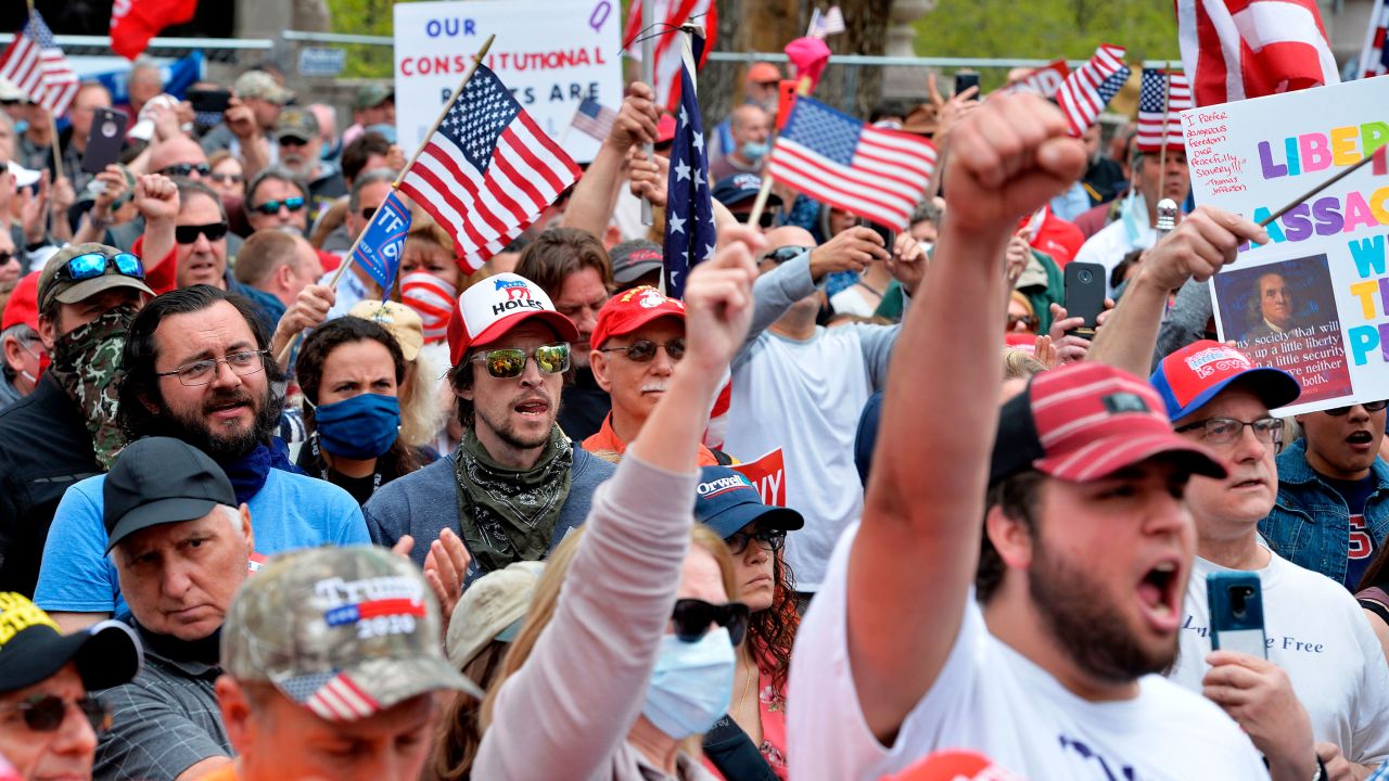 Protesters in Boston rally on May 4 against stay-at-home orders and a law requiring everyone to wear a mask in public.