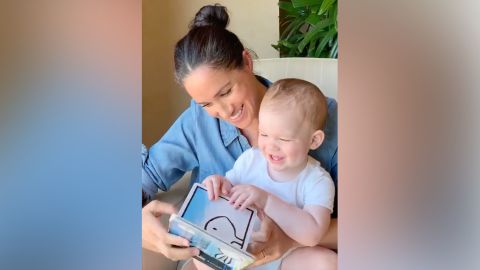 Meghan reads to son Archie for his first birthday.