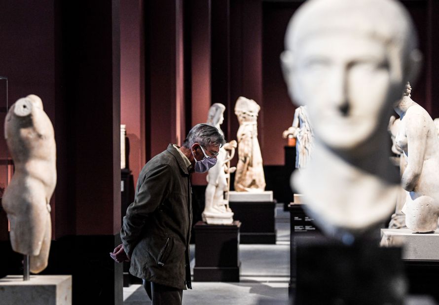 A man wears a protective face mask while visiting the Old Masters Picture Gallery in Dresden, Germany, on May 6. The gallery had been closed for more than six weeks.