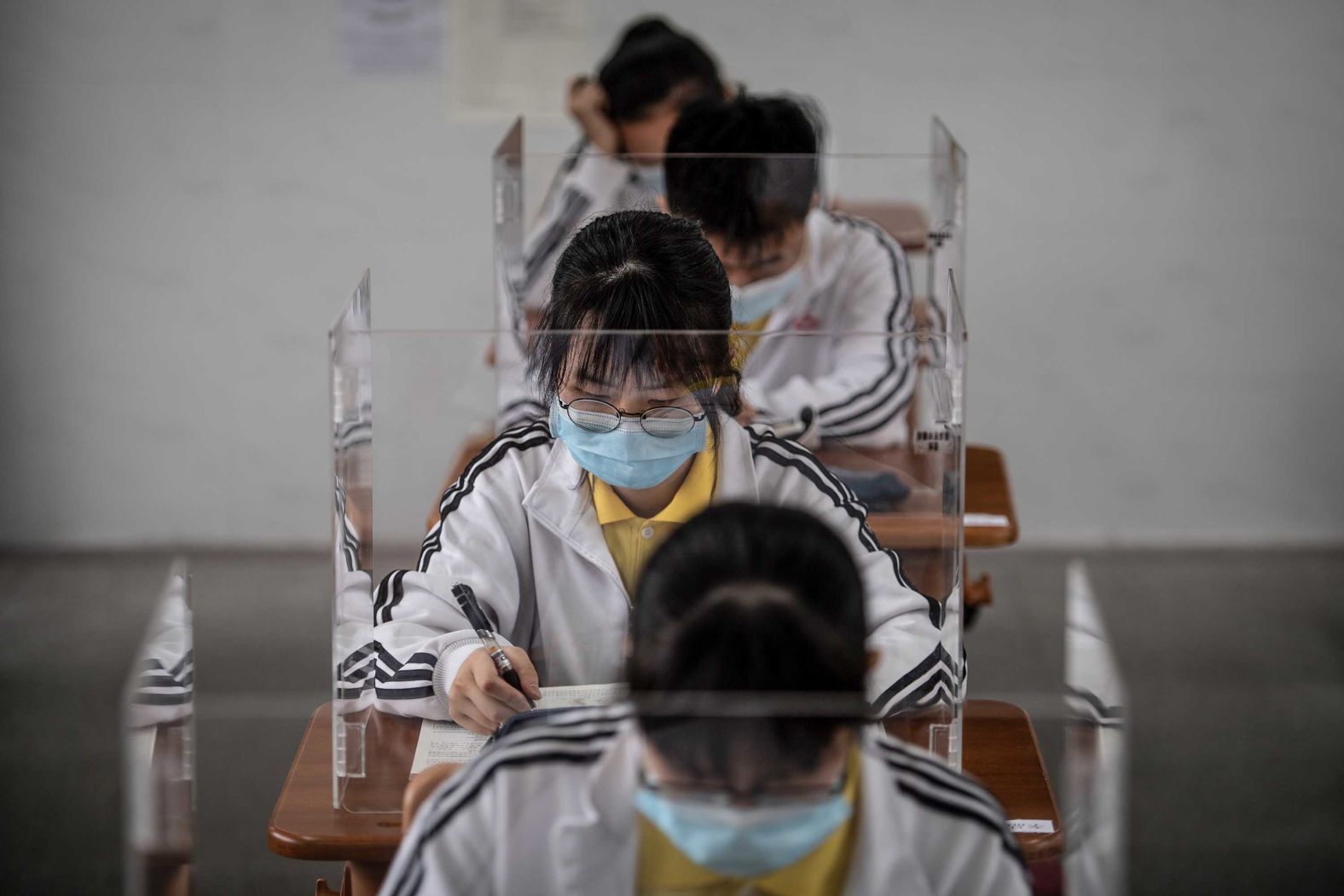 High school students study behind plastic partitions after they <a href="index.php?page=&url=https%3A%2F%2Fedition.cnn.com%2Fworld%2Flive-news%2Fcoronavirus-pandemic-05-06-20-intl%2Fh_fac9298ec5a6b3ef2b537b7d80d6c266" target="_blank">returned to school</a> in Wuhan, China, on May 6.
