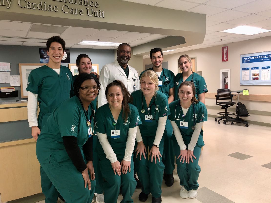 Choi poses for a photo with Michigan State University nursing classmates and an instructor.