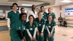 Choi poses for a photo with Michigan State University nursing classmates and an instructor.