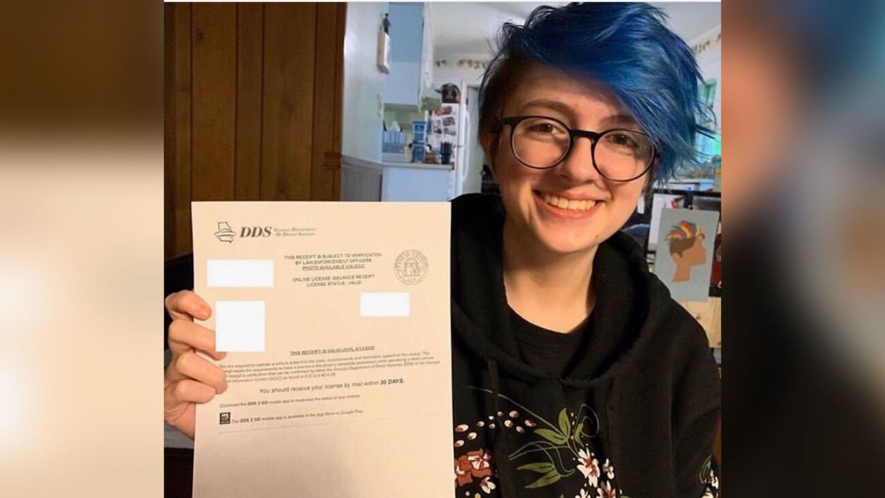 Willa Pevey, 17, holding up a receipt of approval for her new drivers license that she applied for online without taking a road test. 