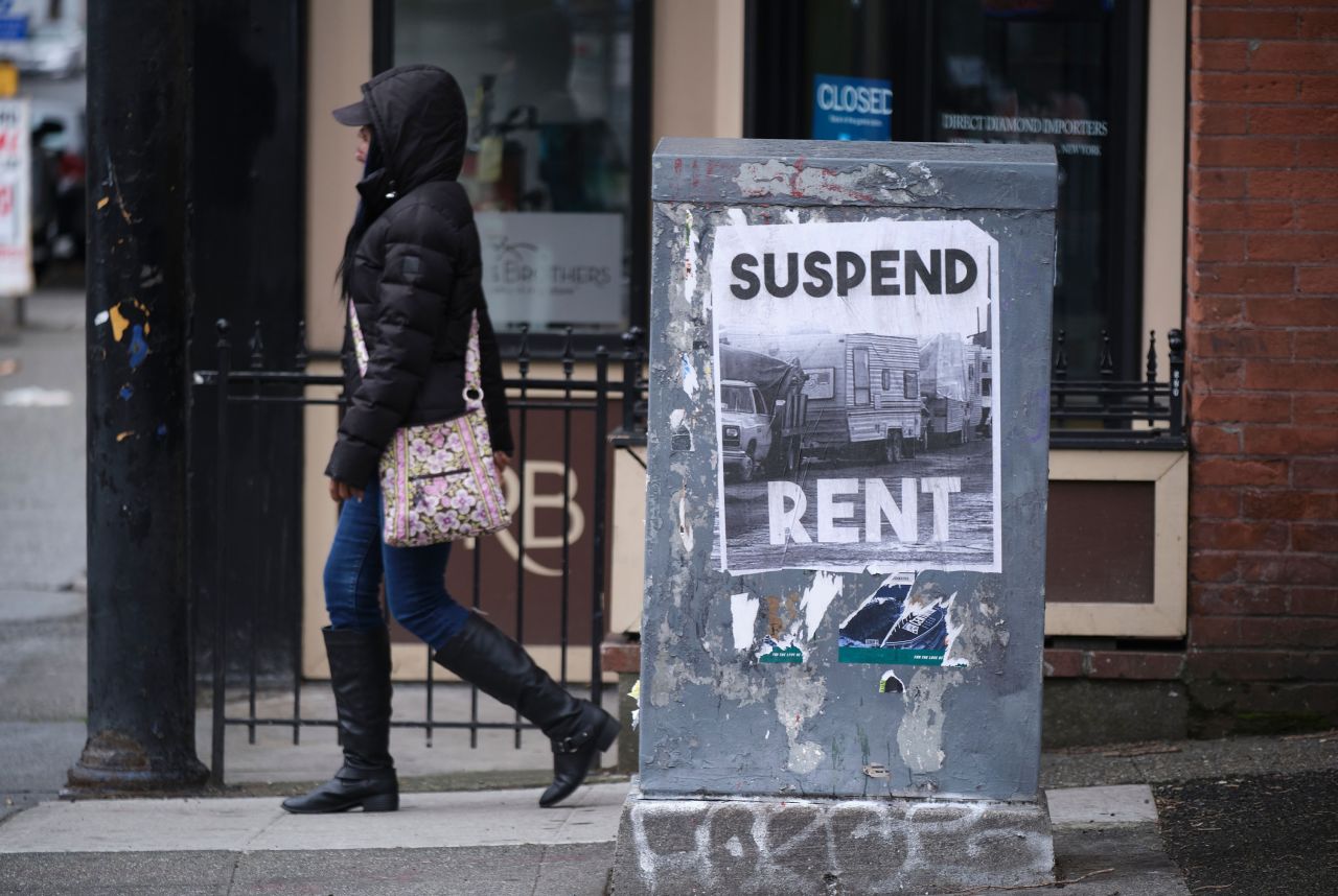 A sign in downtown Seattle, pictured in March, calls for the suspension of rent during the pandemic.