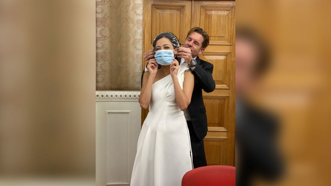 Ivan puts a surgical mask on new bride Rana. Photo: Keith Richburg