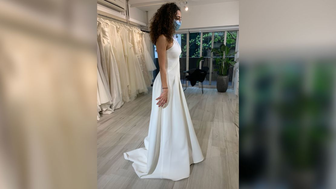 Rana dons a mask for a wedding dress fitting. Photo: Rana Wehbe Watson