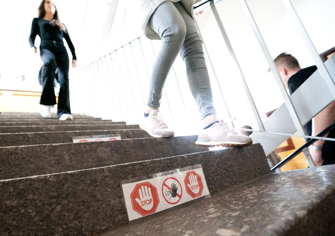 Signposting on stairs and in hallways help students in Ettlingen, Germany, keep their distance.