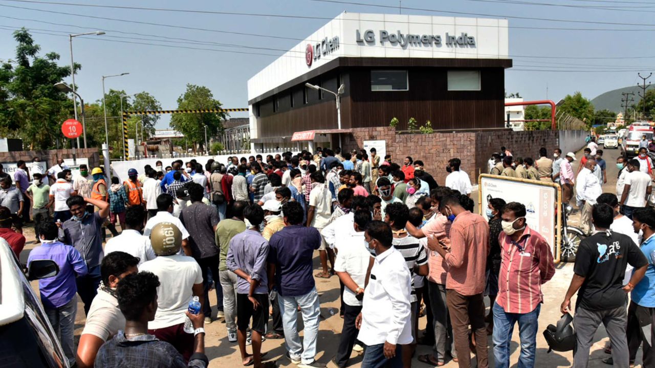 A crowd gathers outside the plant after the leak.