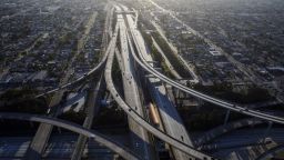 Vehicles drive in light traffic on the Judge Harry Pregerson Interchange between the 105 and 110 freeways in this aerial photograph taken above Los Angeles, California, U.S., on Friday, May 1, 2020. California Governor Gavin Newsom is directing departments to cut spending immediately amid projected deficits of $35 billion, while Los Angeles Mayor Eric Garcetti proposed a budget that calls for civilian workers to take 26 furlough days during the fiscal year that begins in July. Photographer: Patrick T. Fallon/Bloomberg via Getty Images