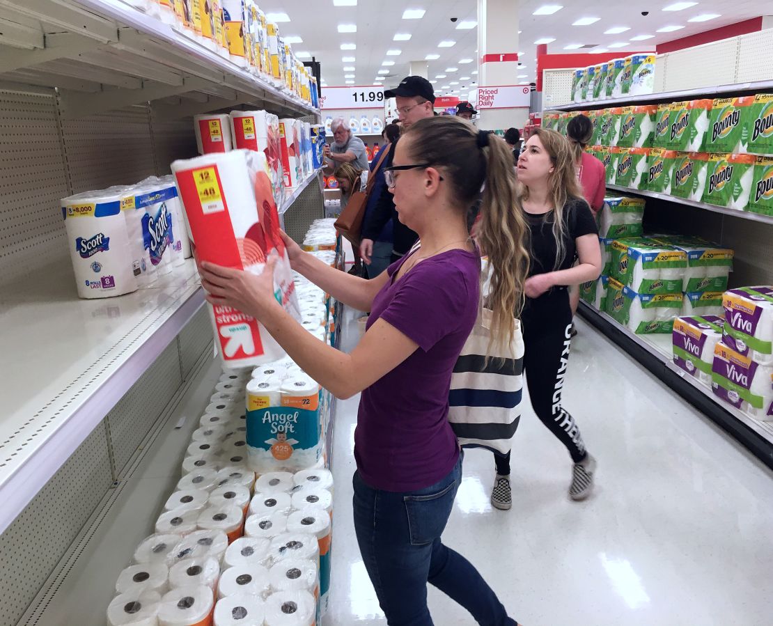 Customers rushed to buy off-brand toilet paper at a Target store in Orlando, Florida, during the panic shopping.