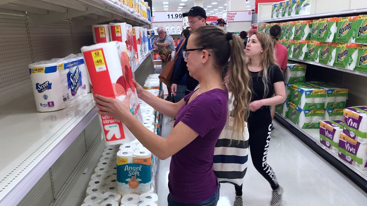 Customers rushed to buy off-brand toilet paper at a Target store in Orlando, Florida, during the panic shopping.
