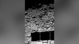Caption: The surface of near-Earth carbonaceous asteroid 162173 Ryugu, as observed by the Hayabusa2
spacecraft just before its landing. This image was produced from images obtained by ONC-W1
at the bottom and ONC-W2 on the side of the spacecraft. The spacecraft's solar ray paddle casts a
shadow on Ryugu's surface.
[Credit: JAXA/U. Tokyo/Kochi U./Rikkyo U./Nagoya U./Chiba Inst. Tech./Meiji U./U.
Aizu/AIST]
