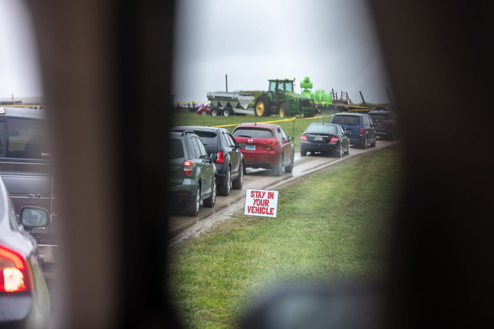 A "stay in your vehicle" sign is pictured in Fawn Township, Pennsylvania, as cars line up for the <a href="index.php?page=&url=https%3A%2F%2Fwww.eveningsun.com%2Fpicture-gallery%2Fnews%2F2020%2F04%2F27%2Fphotos-maple-lawn-farms-fawn-township-pa-drive-through-strawberry-festival%2F3034369001%2F" target="_blank" target="_blank">Maple Lawn Farms drive-thru strawberry festival</a> on April 26.