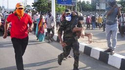 Rescuers evacuate people following a gas leak incident at an LG Polymers plant in Visakhapatnam on May 7, 2020. - At least five people have been killed and several hundred hospitalised after a gas leak at a chemicals plant on the east coast of India, police said on May 7. They said that the gas had leaked out of two 5,000-tonne tanks that had been unattended due to India's coronavirus lockdown in place since late March. (Photo by - / AFP) (Photo by -/AFP via Getty Images)