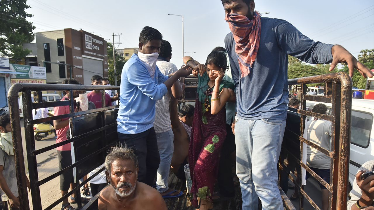 People affected by the gas leak are carried out of a truck to an ambulance in Vishakhapatnam.
