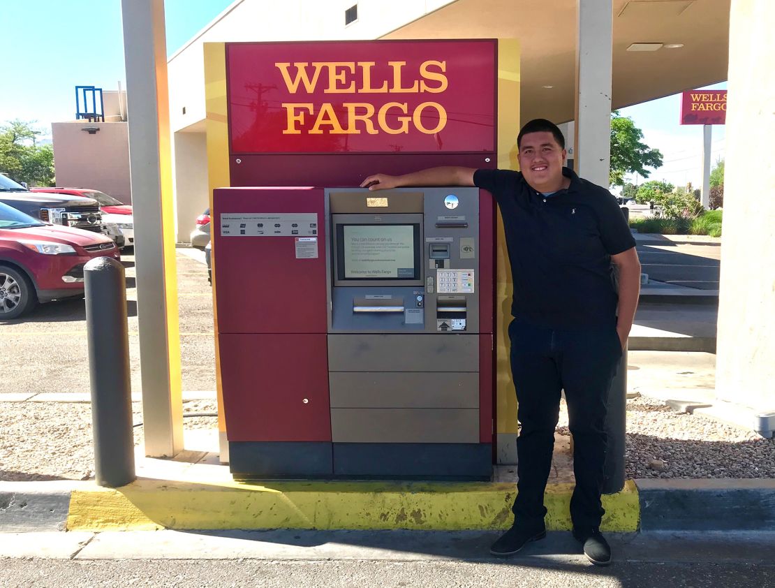 Nunez stands by the ATM where he found the bag.