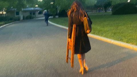 OAN correspondent Chanel Rion seen carrying a chair on White House grounds