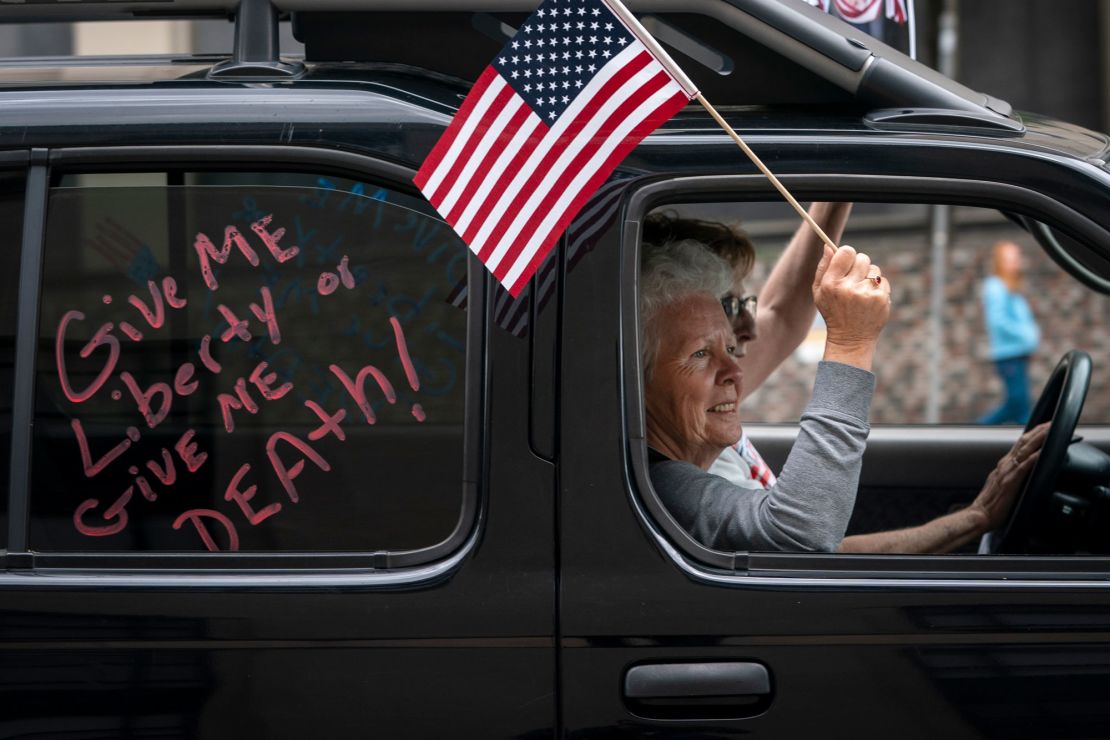 Protesters call for the state to lift stay-at-home orders and reopen the economy in downtown Richmond, Virginia on Wednesday. 