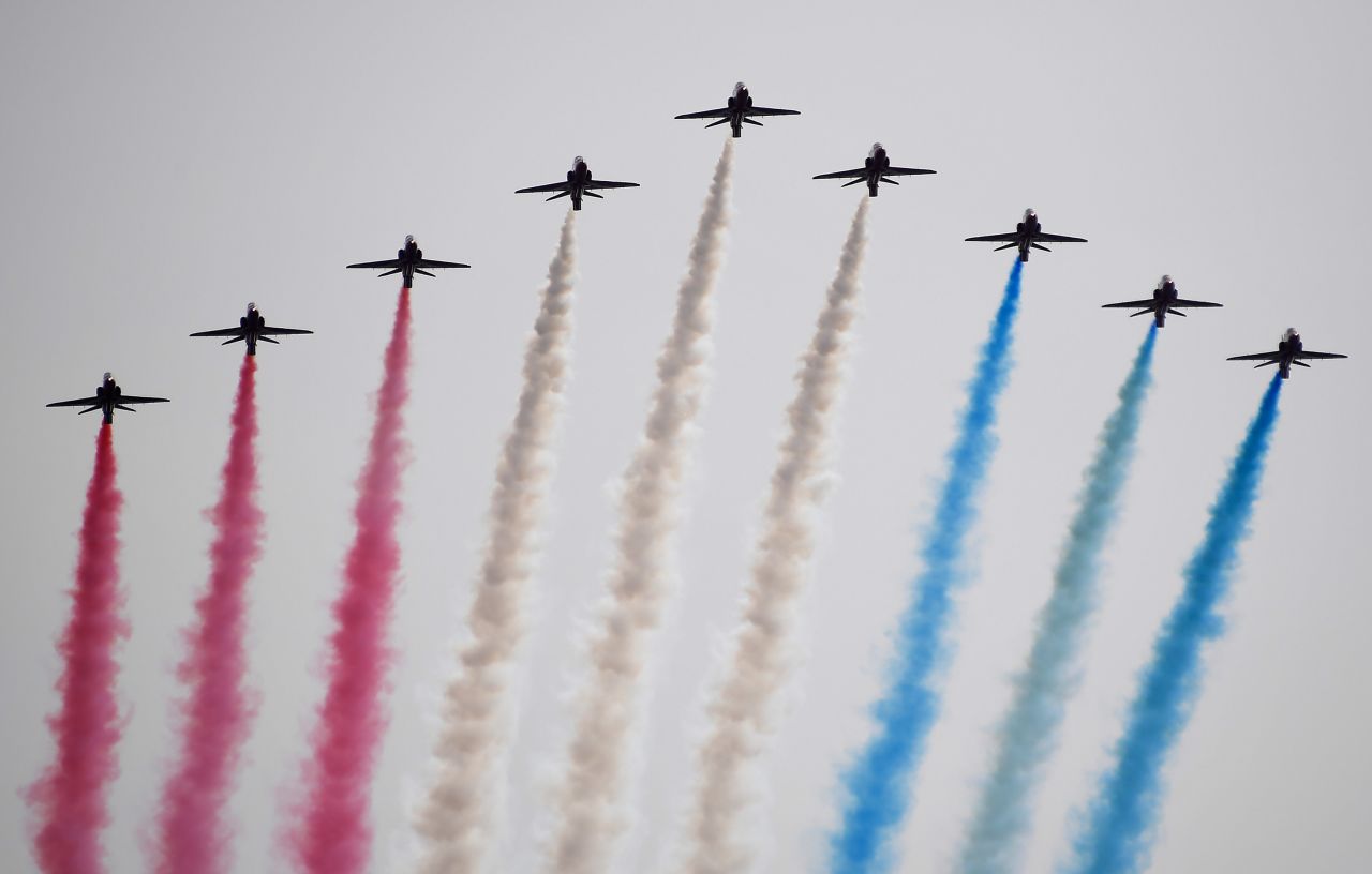 The Red Arrows, officially known as the Royal Air Force Aerobatic Team, fly over London.