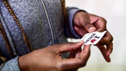A voter seen holding a sticker with the words I love voting at the Barrack Recreation Centre in Down town Columbus during the primary elections in November 2018.