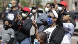 Protesters listen during a rally outside of the City County Building, Thursday, May 7, 2020, in Indianapolis. The crowd was protesting the fatal shooting Wednesday evening by an Indianapolis Metropolitan Police Officer. (AP Photo/Darron Cummings)
