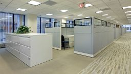 Office area with cubicles in high rise building