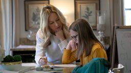 Farrah Eaton assists her daughter Elin, 11, with homeschooling on March 18, 2020, in New Rochelle, New York. Schools in New Rochelle, a hot spot in the US for the coronavirus pandemic, were suspended on March 13, and parents have been tasked with carrying out distance learning programs at home. 